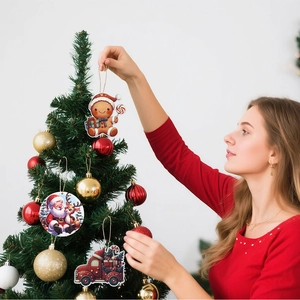 Detail of colorful wooden Christmas ornaments with Santa and reindeer on a tree