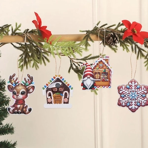 Detail of 3D printed wooden Christmas ornaments showing reindeer and gingerbread house