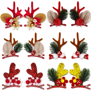 Detail of 6 pairs of Christmas reindeer antler hair clips with bells and plush balls