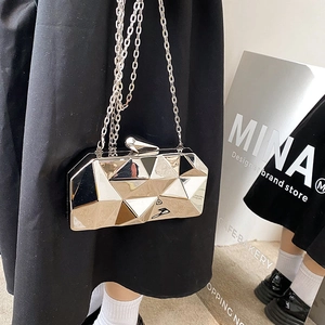 Silver geometric cube clutch bag with metallic finish and chain strap for evening events