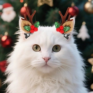 Detail of cute reindeer antler hair clips on a white cat for Christmas party decoration