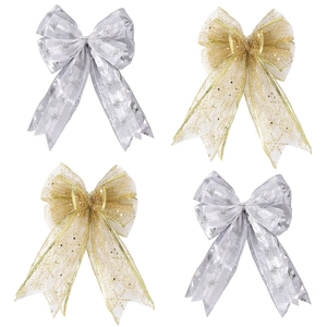 Detail of Christmas tree gold and silver mesh bows with snowflake and Merry Christmas print