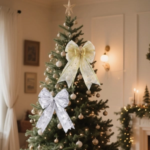 Close-up of gold and silver mesh Christmas bows with snowflakes on a decorated tree