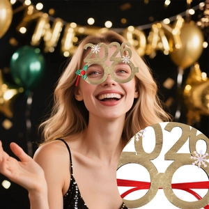 Detail of 2026 festive glasses with gold glitter, snowflake and holly leaf decor