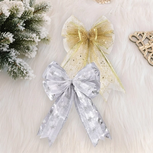 Detail of Christmas mesh bows with silver Merry Christmas lettering and gold glitter patterns