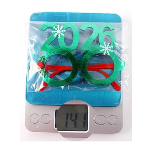 Detailed view of lightweight 14.1g Christmas 2026 novelty glasses on a weighing scale