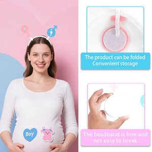 Detail of gender reveal headband with blue boy sticker and pink bear icon decor