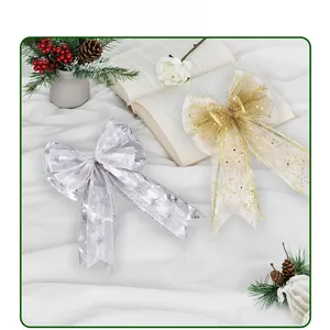 Close-up of metallic silver and gold glitter bows for Christmas tree decoration