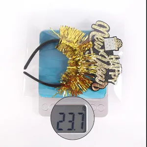 New Year party headband with Happy New Year glitter sign on scale showing 23.7g weight