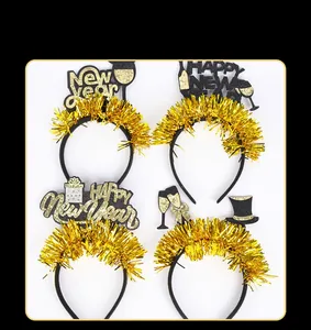 Detail view of 2026 New Year headbands featuring gold tinsel and celebratory party elements