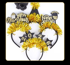 Flat lay of 2026 New Year headbands with gold glitter stars and festive party details