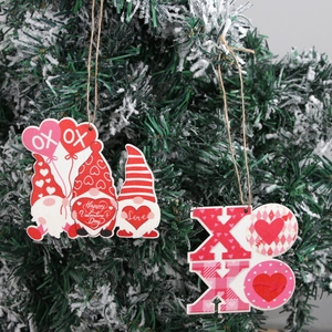 Valentine wooden gnome ornaments and XOXO hanging decorations on pine tree branches