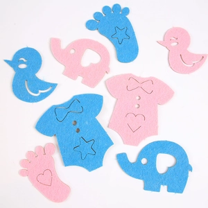Detailed felt DIY elephant and baby romper shapes in pink and blue for gender reveal parties