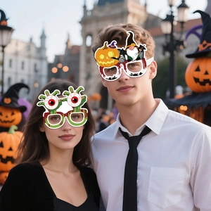 Funny Halloween paper glasses featuring pumpkins and eyeballs worn at a party
