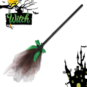 Detail of Halloween witch broom with mesh bristles and green ribbon bow on white background