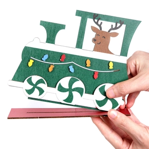 DIY wooden Christmas train table ornament with reindeer and candy wheels on a red base