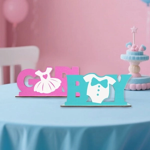 Detail of wooden BOY and GIRL table signs for baby gender reveal party decorations