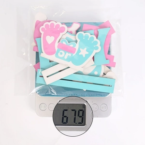 Weight display of baby shower elephant party decorations in blue and pink packaging