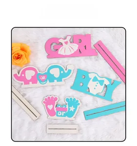 Detailed wood gender reveal party signs with pink GIRL and blue BOY table decorations