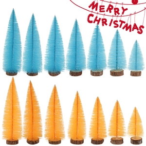 Macro shot of colorful mini bottle brush Christmas trees in blue and orange shades