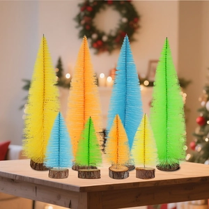 Miniature colorful sisal Christmas trees with wooden bases on a festive table