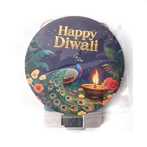 Detailed view of Happy Diwali wooden hanging sign on a scale showing weight 158.7g