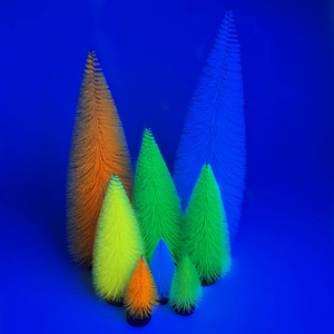 Colorful mini fluorescent Christmas trees with wooden bases on a bright blue background