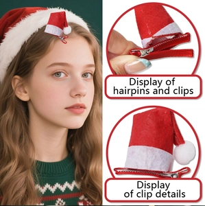Detail eines Mini-Weihnachtsmützen-Haarclips aus rotem Plüsch mit silberner Entenschnabelklemme