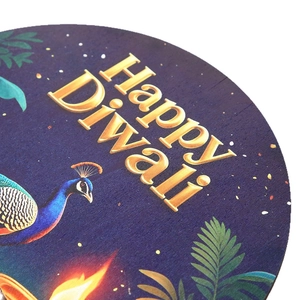 Round wooden Happy Diwali welcome sign featuring blue peacock patterns and gold lettering