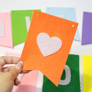 Close-up of colorful felt bunting flags with white heart decor for retirement parties