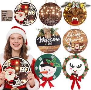 Detail of Christmas wooden door signs with LED lights featuring Santa and Reindeer motifs