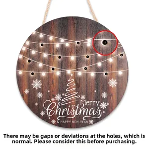 Detail view of the jute rope hanging hole on a rustic wooden Merry Christmas door sign