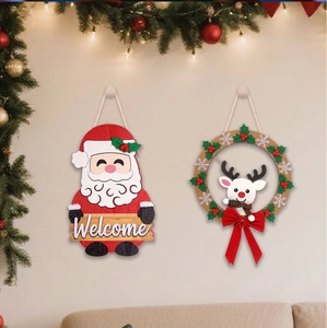 Close-up of LED wooden Christmas hanging signs with Santa and Reindeer on a beige wall