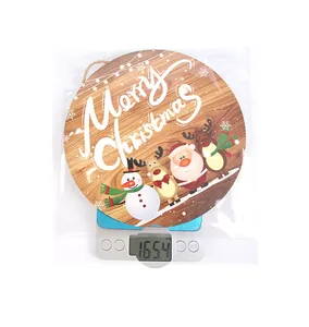 Weight measurement of a wooden LED Christmas sign with cartoon Santa and snowman figures
