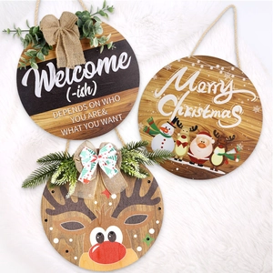 Three circular Christmas wooden signs with LED lights, festive bows, and holiday patterns