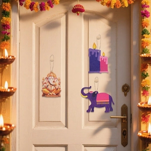 Diwali wooden pendant set with Ganesha and elephant hanging on a white door