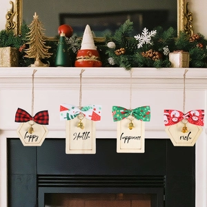 DIY Christmas wood ornaments set with festive bows and bells on a holiday fireplace