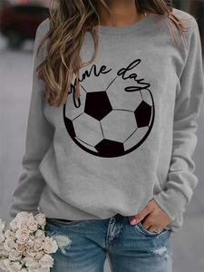 Close-up of the grey sweatshirt showing Game Day typography and football graphic print
