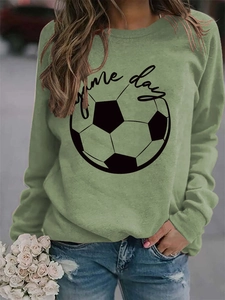 Detail of sage green GAME DAY sweatshirt showing soft cotton fabric and football print