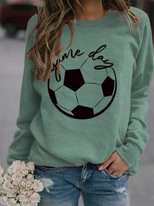 Detail of sage green sweatshirt featuring black football graphic and Game day text print