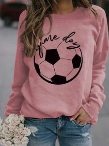 Detailed view of pink long sleeve sweatshirt with black game day text and football print