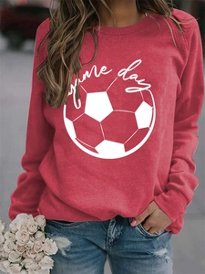 Close-up of red Game Day sweatshirt featuring white football print and cursive lettering