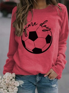 Close-up of Game Day script and football graphic on a red crewneck sweatshirt