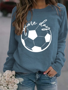Detail of navy blue sweatshirt featuring white Game Day football print on fabric