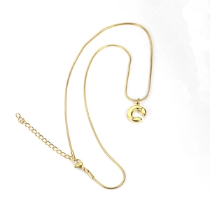 Detailed view of golden snake chain necklace with smooth 3D letter C pendant and adjuster