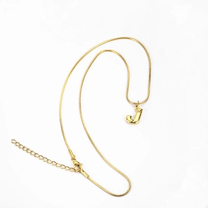 Detail view of a gold-plated stainless steel snake chain necklace with letter J pendant