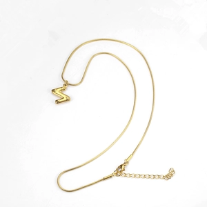 Detailed view of golden snake chain with a capital Z letter pendant and lobster clasp