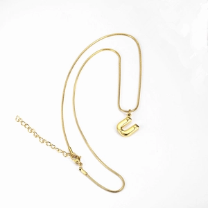 Detail of gold-plated initial U pendant on a smooth snake chain with lobster clasp