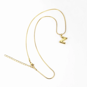 Macro view of 3D letter Z pendant with gold snake chain and lobster clasp closure