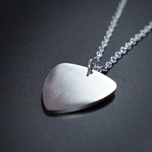 Minimalist guitar pick pendant necklace in brushed stainless steel with metallic chain